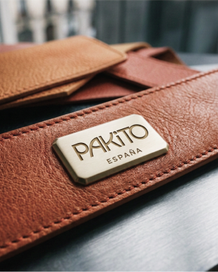 Pakito brand plate on brown leather