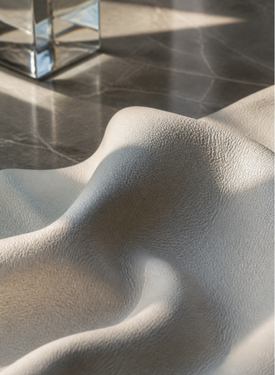 Textured ivory material showing a pronounced grain