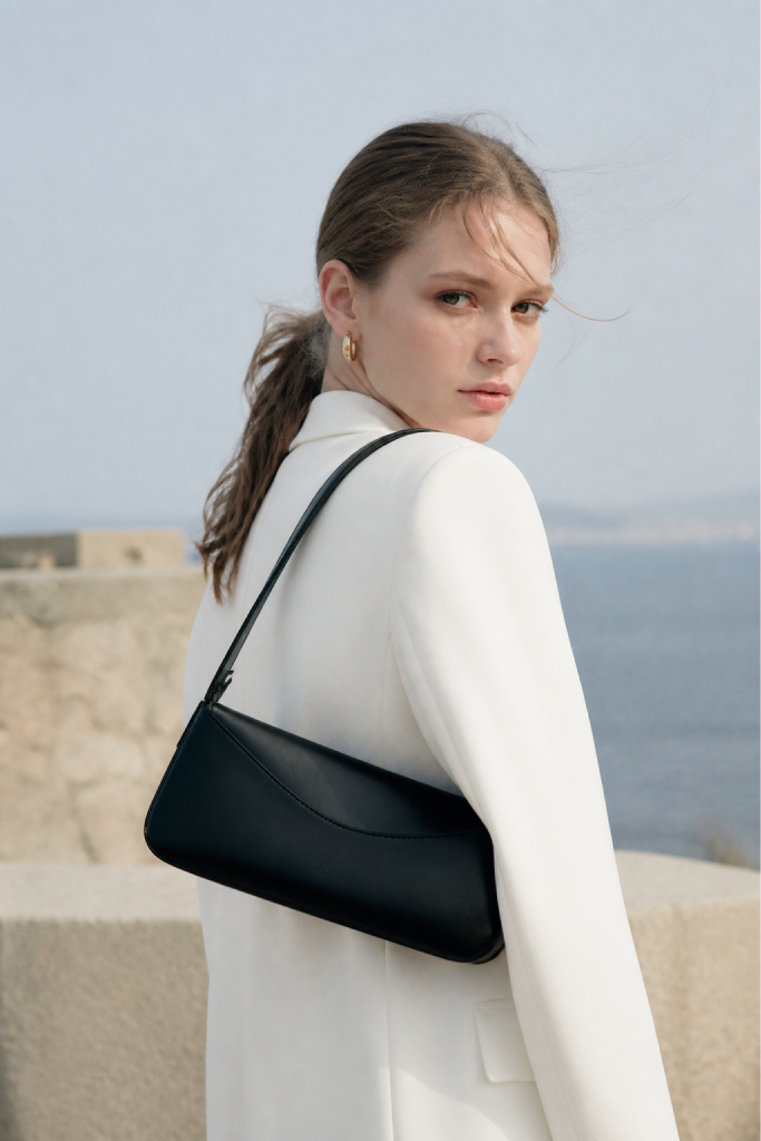 Woman with black bag from the Elegant Classics collection