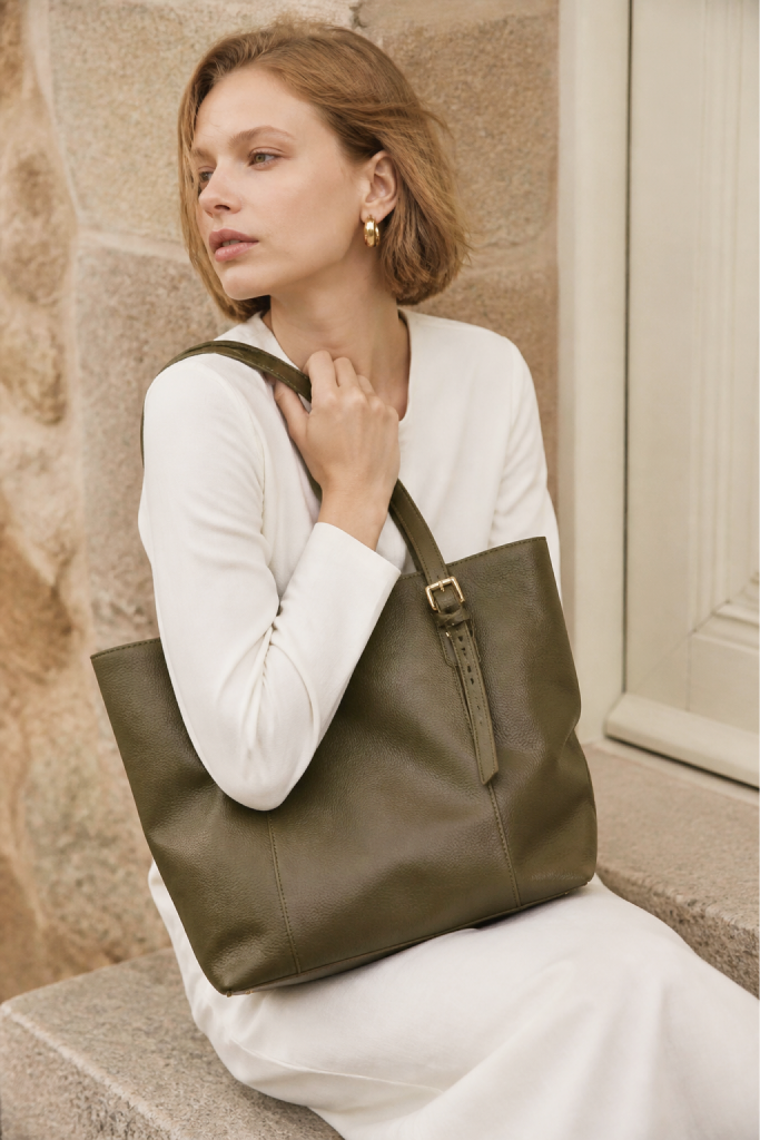 Woman with green bag from the Evening Collection